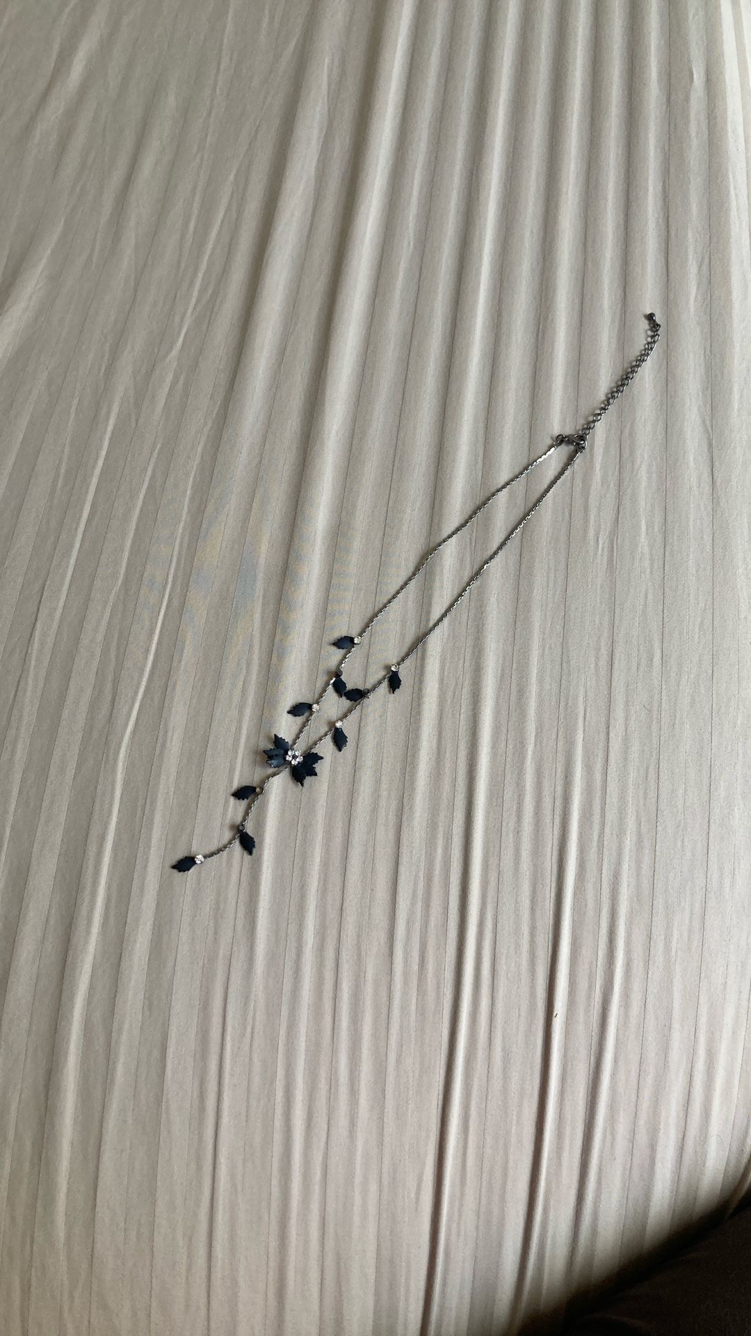 Silver necklace with black diamond petals