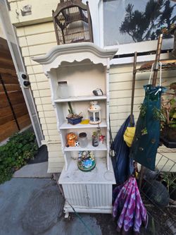 Antique birdcage and outdoor hutch, with tchotchkes