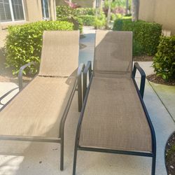 2 beige Chaise Lounge Chairs with metal frame, outdoor patio furniture