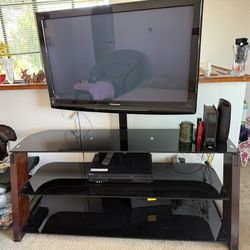 Tempered glass TV stand and Panasonic TV include