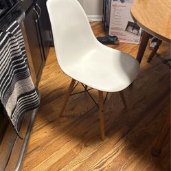 Set Of Four White Eames Chairs