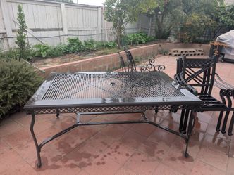 A set of aluminum outdoor table and chairs (one table and six chairs), plus a complimentary aluminum and glass outdoor table.