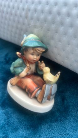 A Goebel Hummel 'Singing Lesson' figurine, model #63, with a TMK-3 mark.