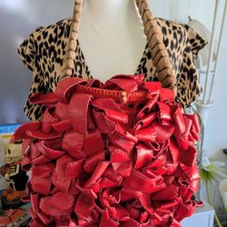 Bold Fun & beautiful, and totally unique! This vintage red leather shoulder bag is handmade with hand-tied red leather details and a charming wood Han
