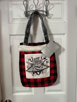 Nightmare Before Christmas "Frightfully Festive" Tote Bag.  Brand new with tags.  Size bag without straps approximately 17 inches long and 14 inches w