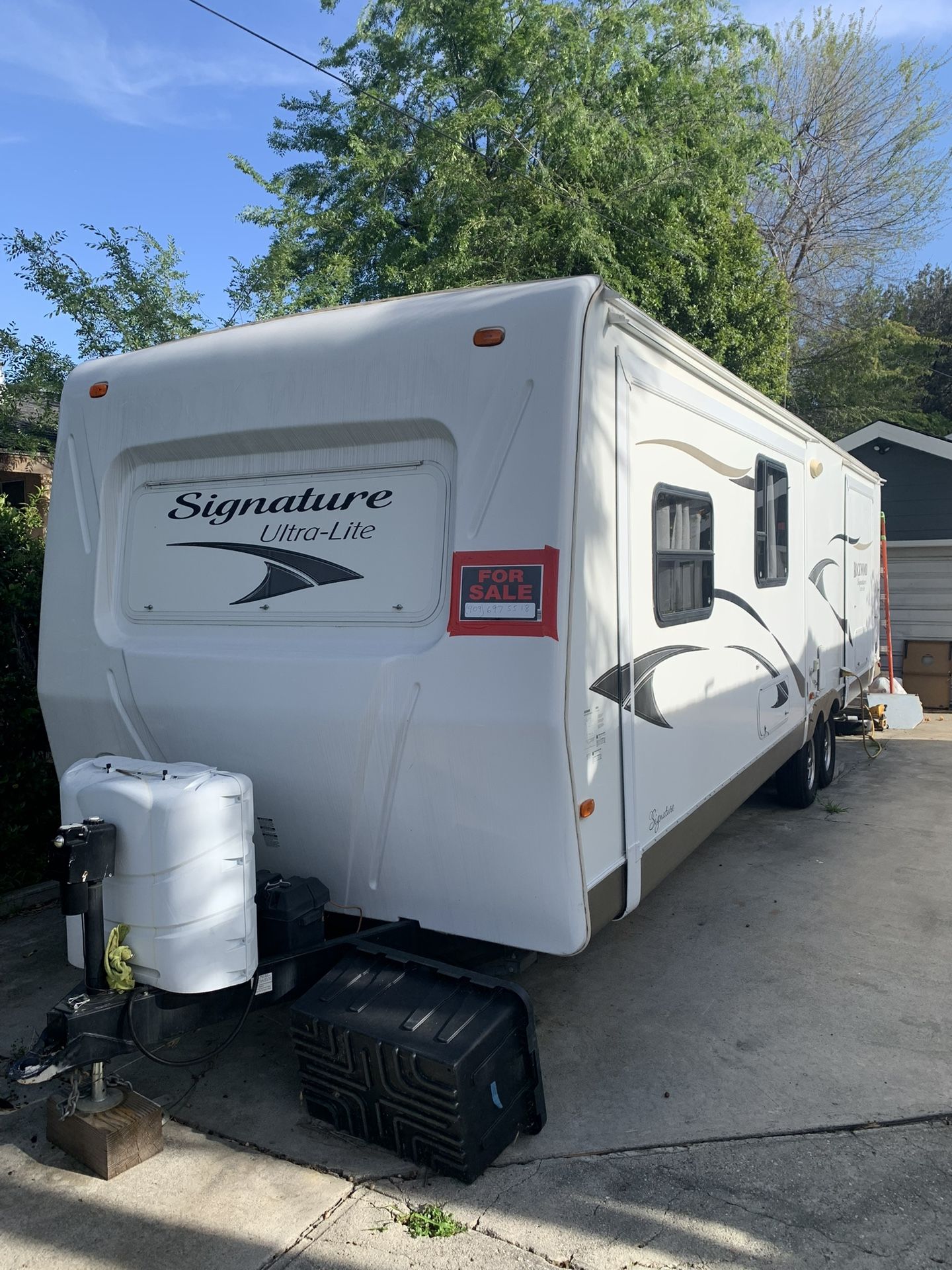 2012 Forest River 32’ long, sleeps 6 on 3 beds, has 2 side slide outs