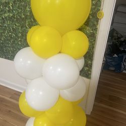 Balloon Arch And Two Standing Ones