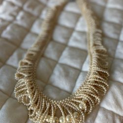 AI Overview vintage glass faux pearl graduated looped fringe necklace
