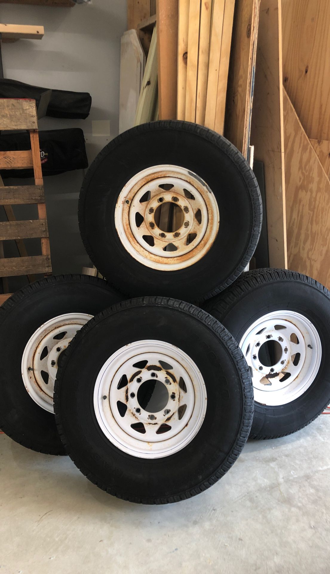 Wheels 8 on 61/2. Tires Bronco 235 85 16. E Load. Old, with extremely low mileage. For trailer only!
