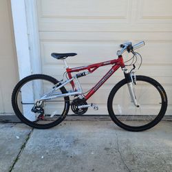 MONGOOSE RENEGADE full suspension mountain bike. 21 speed. 26 tires. 18" ALUMINUM frame. Everything works excellent. 