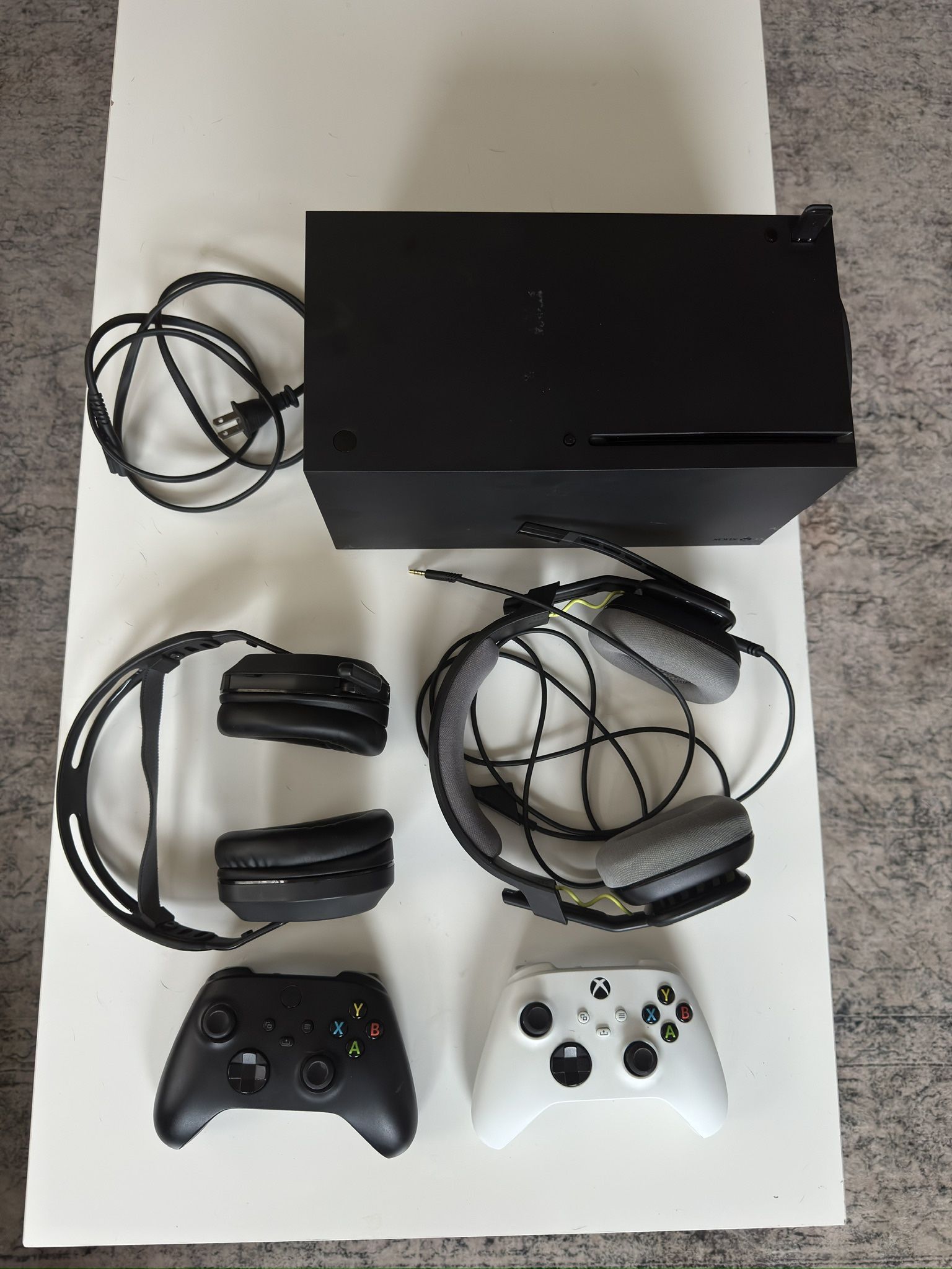 XBOX Series X with accessories and controllers.  