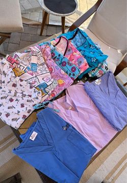 2 Boxes of Medical Scrubs (M-XL)+Book