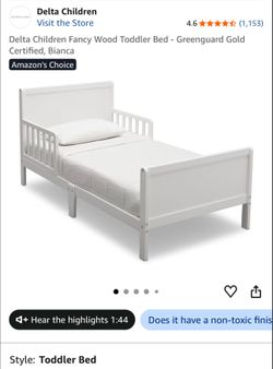 White in box still toddler bed and mattress