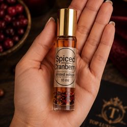 Spiced Cranberry 10 mL Roll-On Perfume Oil Warm Fruity Spiced Scent  A warm, inviting fragrance combining tart cranberry and juicy red berries with co