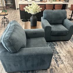 2 blue single piece couches