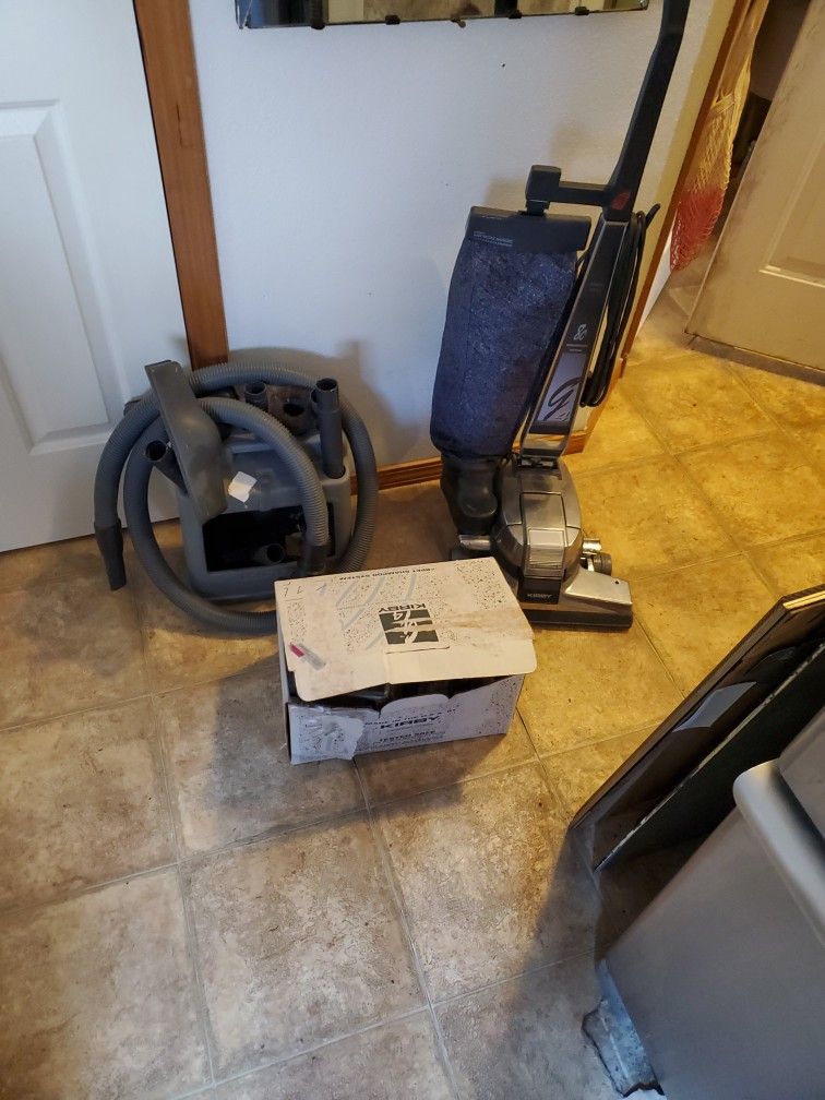 kirby vacuum circa 1990s, works incredibly! comes with all attachments, instruction manuals and full shampooing system