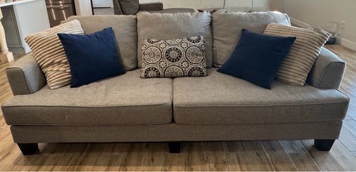 Gray Fabric Sofa, Love seat, chair and ottoman.