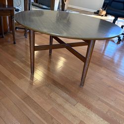 Mid-century modern  wooden laminate spinning coffee table.  Sleek vintage style.