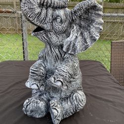 Large, happy elephant statue