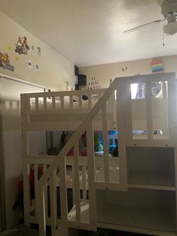 Full bunk bed with stairs and book shelves