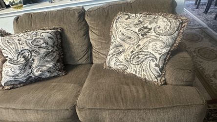 Tan Fabric Two-Seat Sofa with Throw Pillows
