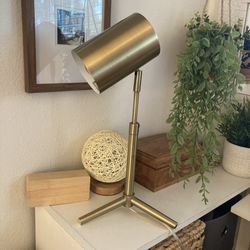 Brass colored desk lamp