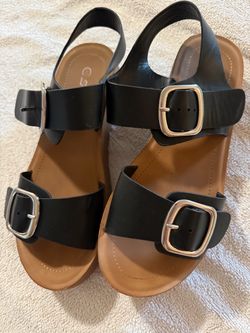 Black sandals with silver buckles