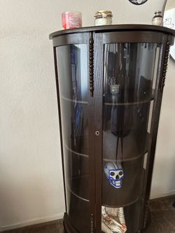 Dark brown curio cabinet