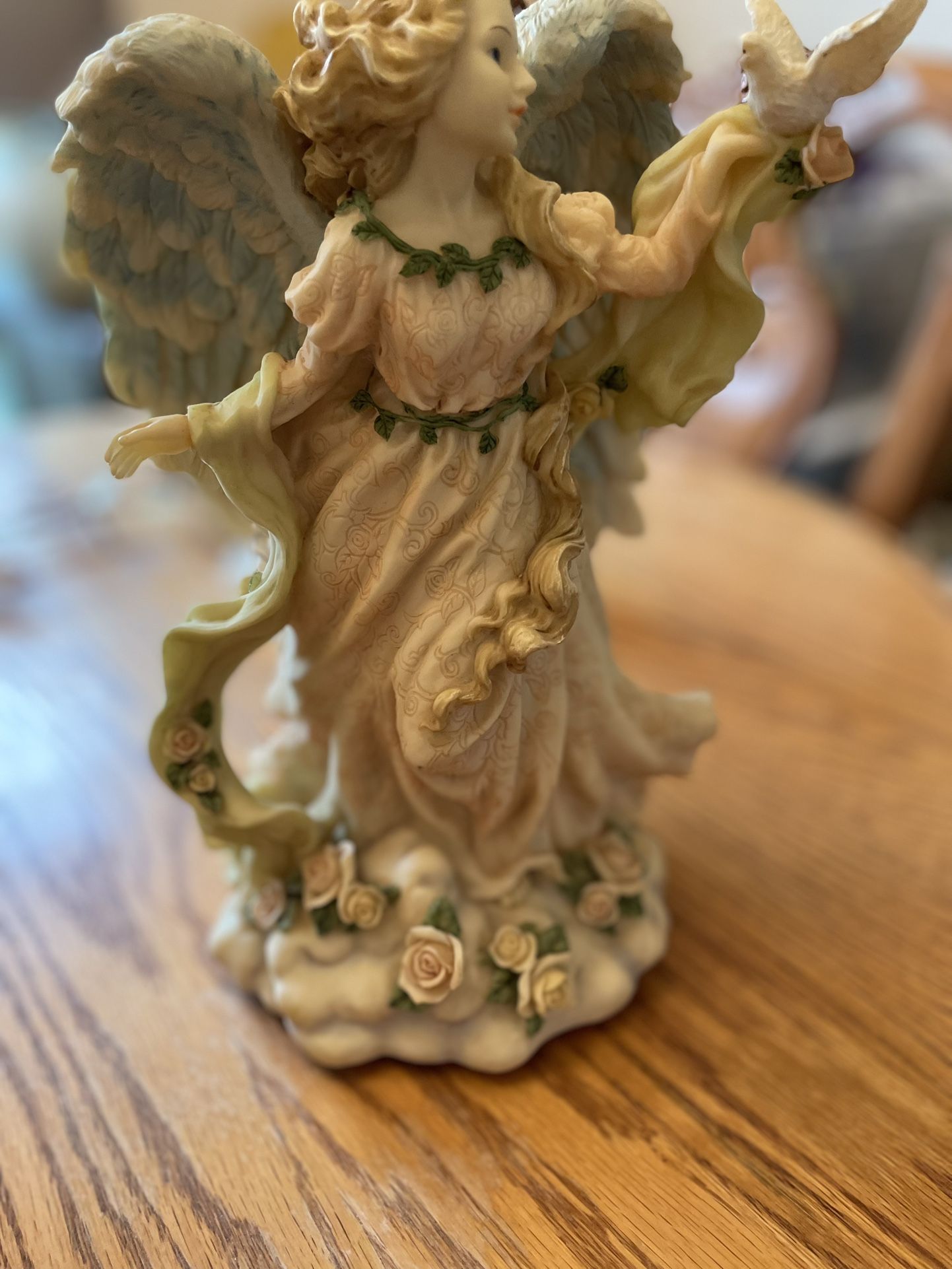 Angel figurine music box plays hark The Herald Angels Sing