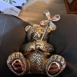This is a silver-plated teddy bear piggy bank by Reed & Barton. See last picture for msrp