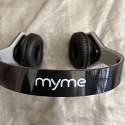 MyMe Wireless Headphones – Black & White  Comfortable over-ear wireless headphones by MyMe. Sleek black and white design with cushioned ear pads and a