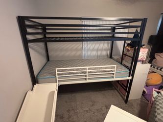 Custom three-story bunkbed with slide