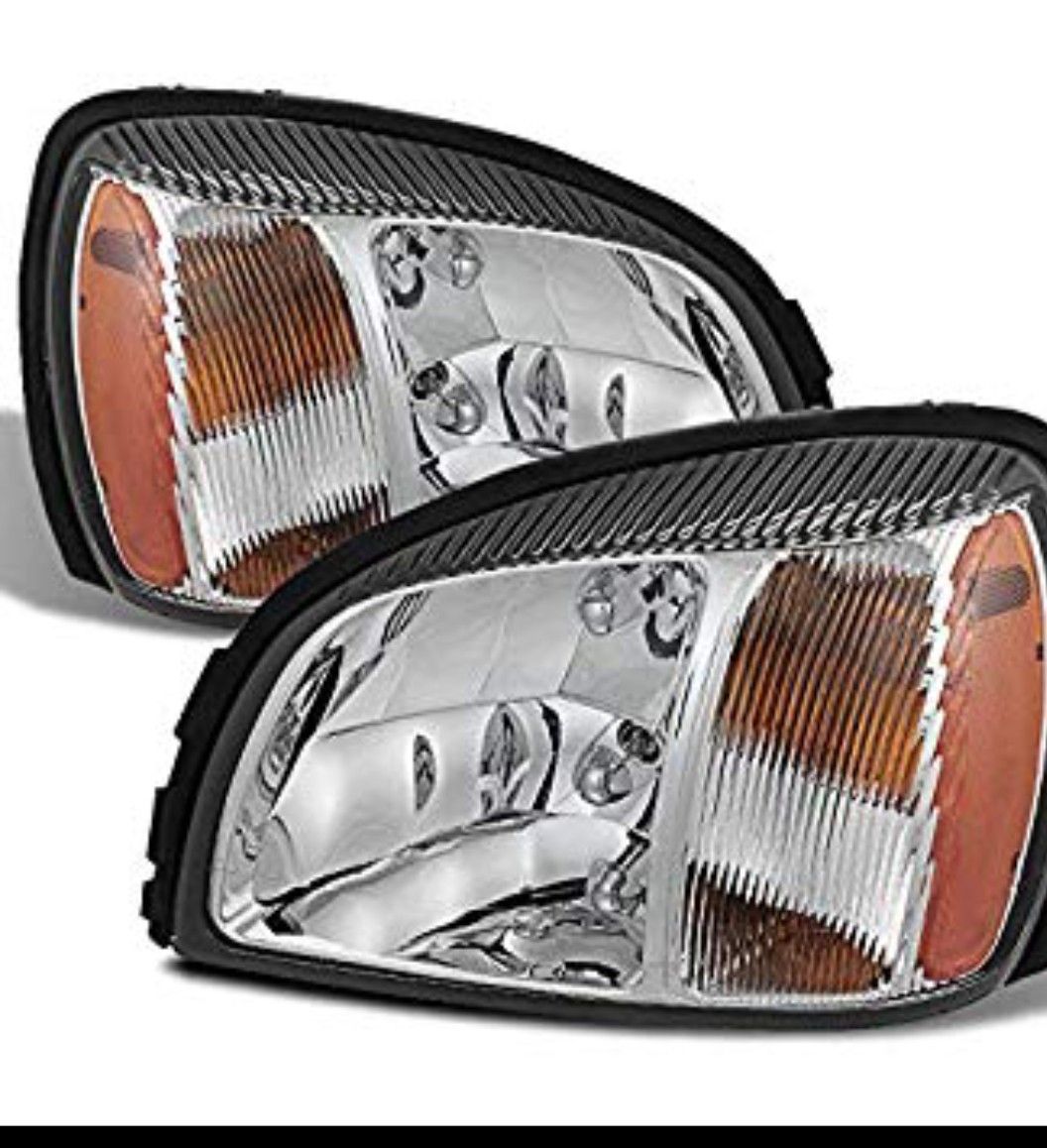 New , Never Installed 2000- 2005 Cadillac Deville Pair Headlights with bulbs