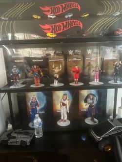 Figure displays hot wheels,masters of universe and wwe, Disney zombies 4