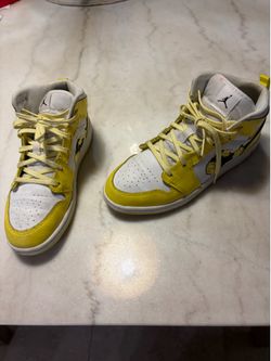 Nike Air Jordan yellow and white sneakers