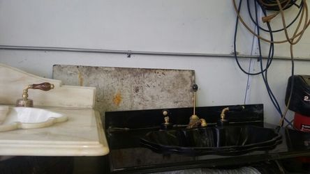 Vintage Sherle Wagner Marble sinks with gold fixtures that belong to Harry Belafonte