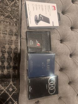 Two colognes and a wallet And  Phone Holder 