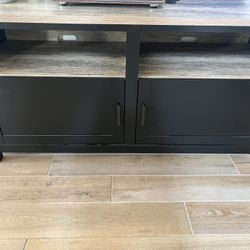 Two Entertainment Tv Consoles, Two Square End Tables, And A Book