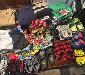 Variety of boys clothing items and shoes