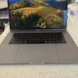 2019 Apple MacBook Pro 15" RETINA Laptop w/ TOUCHBAR Intel Core i9, 512GB SSD