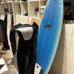 Surf Board 40    Wetsuit 50. Size Small. 