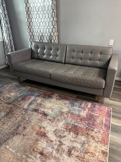 Gray leather sofa from IKEA