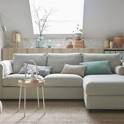 Beige color sectional sofa with chaise lounge and storage underneath
