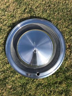 1 Plymouth Fury hubcap. $25.