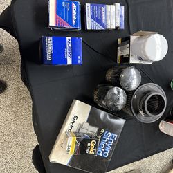 Unused oil filters , iridium spark plugs, and air filters