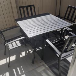 6-Piece Black Patio Table W/ 4 Chairs & Beige Umbrella
