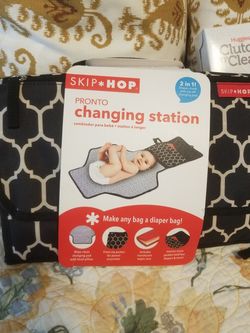 Brand new changing pad, and wipe holder. Skip Hop.