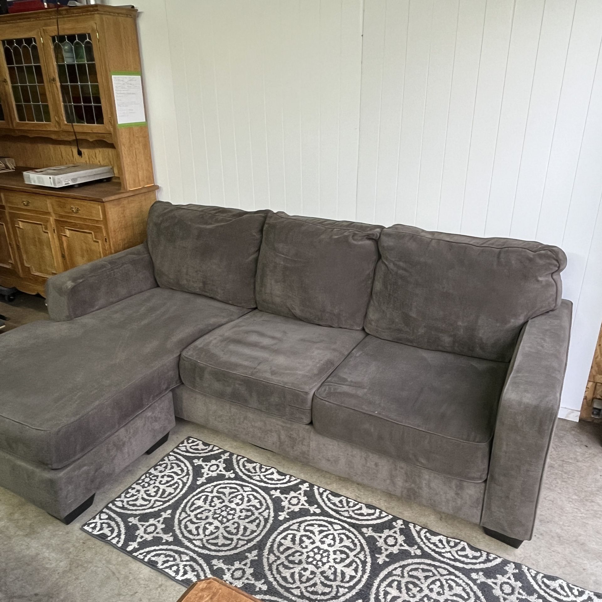 Gray green sectional couch with movable ottoman