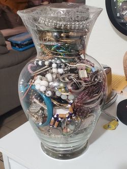 Five Glass Vases Stuffed Full Of Jewelry