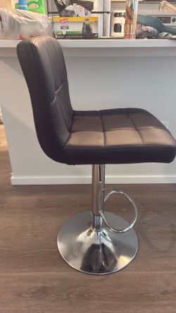 Set of 4 adjustable bar stools. Like new. No tears or stains.